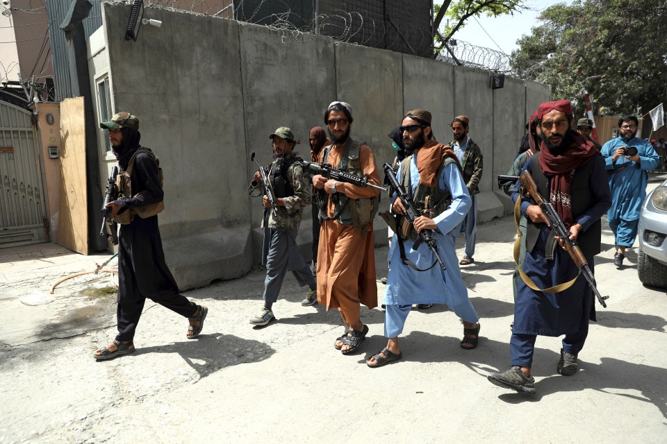 Taliban fighters patrol in Wazir Akbar Khan neighbourhood in the city of Kabul