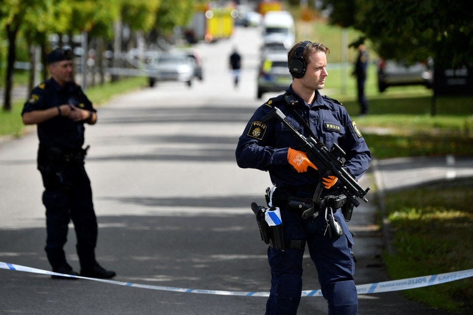 Police outside the school in Sweden where a teacher was seriously wounded