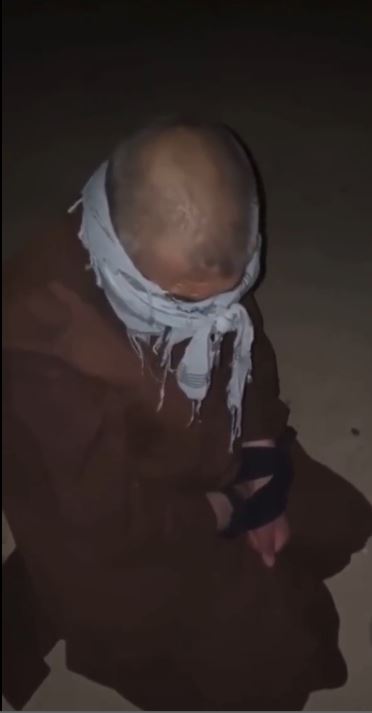 A still from the horrifying video that appears to show Haji Mullah Achakzai being murdered