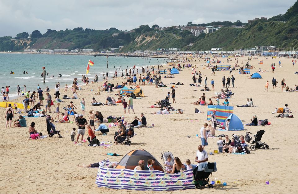 Sunbathers on the beach in Bournemouth this afternoon