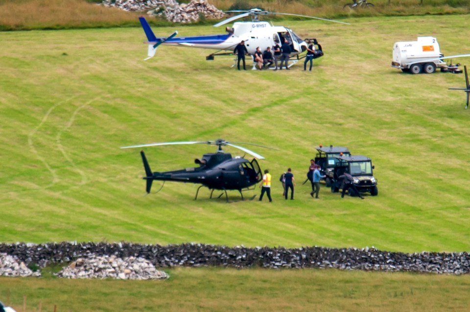 A Peak District photographer, who captured the remarkable moment said: '[Tom’s] helicopter was all black to match his outfit'