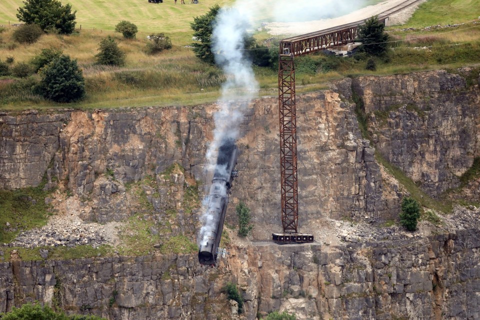 A train is sent off a cliff during filming for the new Mission Impossible movie