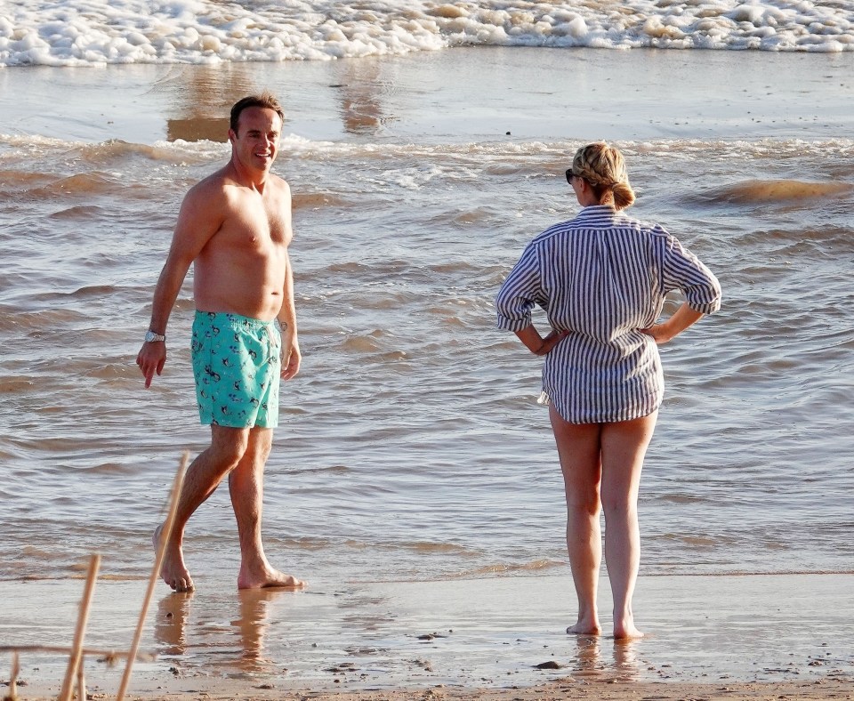 Others on the beach said the pair were 'behaving like typical newlyweds'