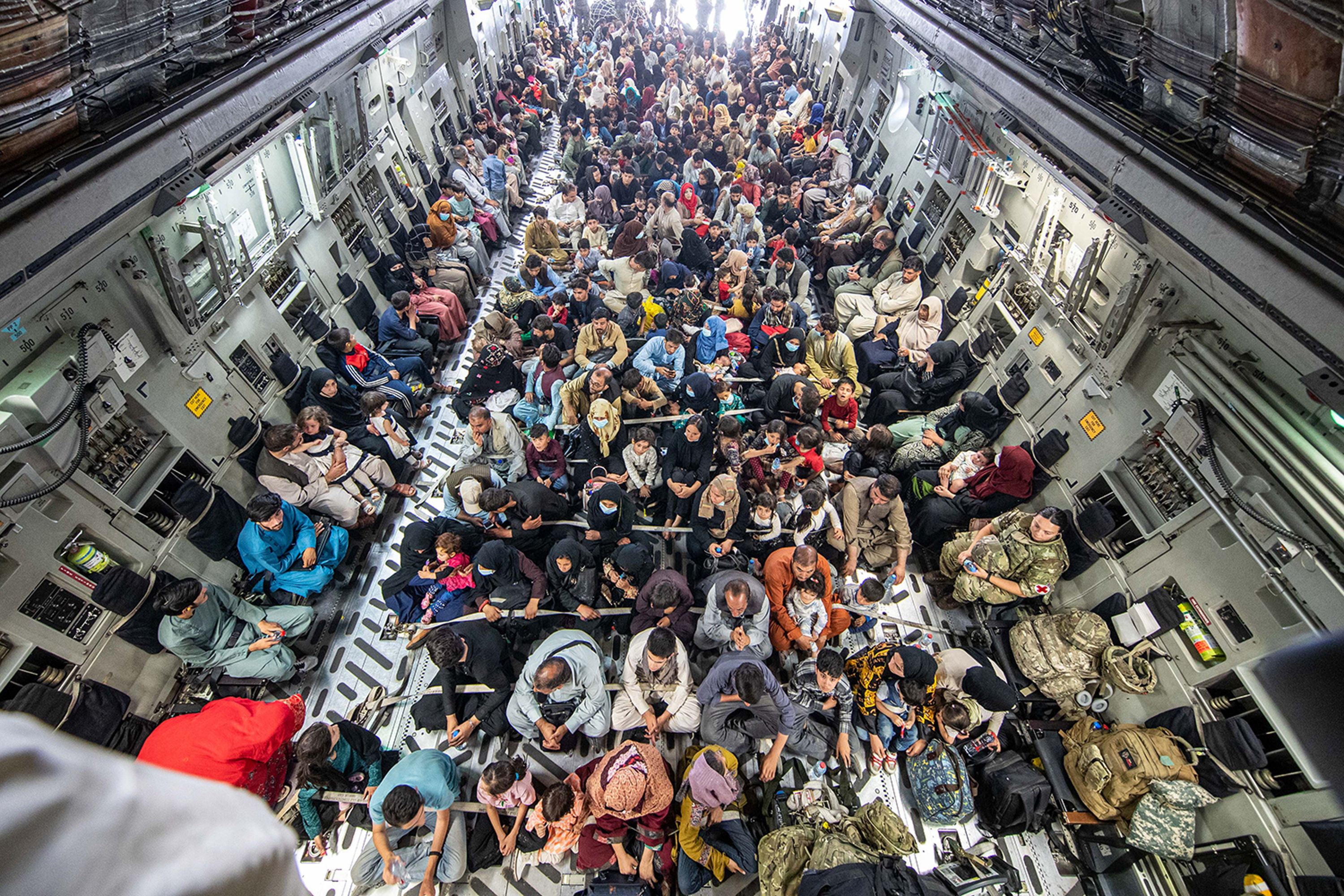 A full flight of 265 people supported by members of the UK Armed Forces onboard an evacuation flight out of Kabul airport, Afghanistan