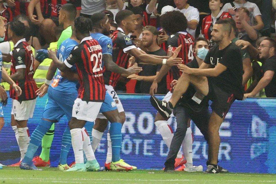 One fan tried to throw a KICK towards Dimitri Payet