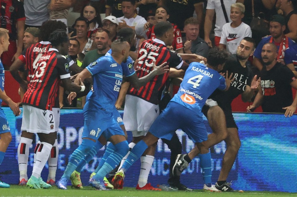 Idiotic fans stormed onto the pitch to confront the players