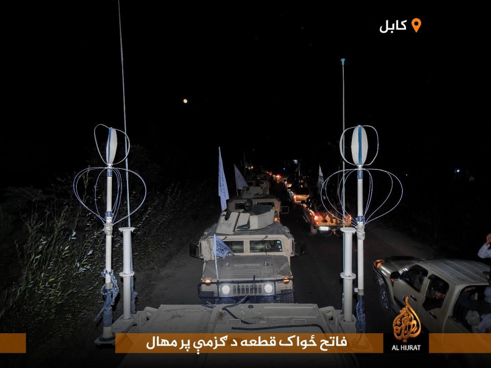 Taliban Humvees and a parade of trucks