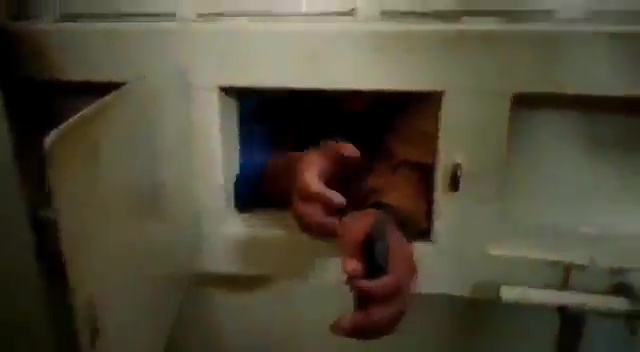 In the footage, a man shows where he claims he was tortured