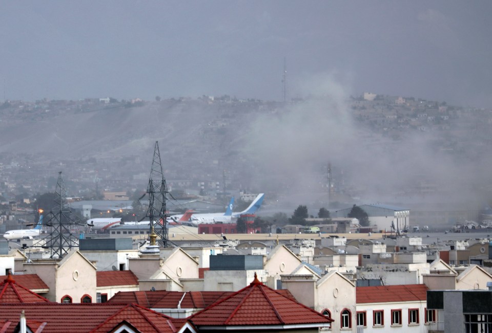 Smoke rises over the airport after the explosion