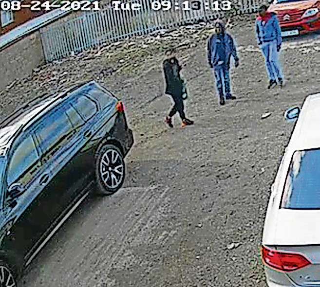 Three individuals were seen walking away from the vehicle