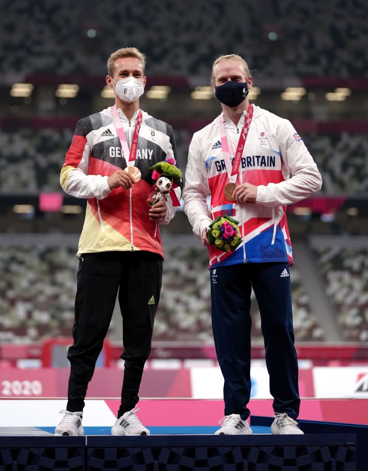 Jonnie Peacock with his Bronze medal alongside joint Bronze medal winner Germany’s Johannes Floors