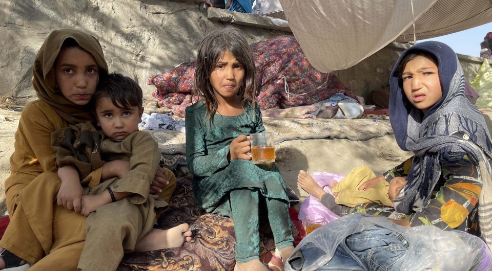 Frightened children are among the thousands of displaced families in Kabul