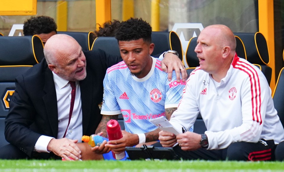 Mike Phelan was seen consoling Jadon Sancho after he was subbed off at Molineux