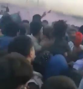 Refugees are crushed together in the melee