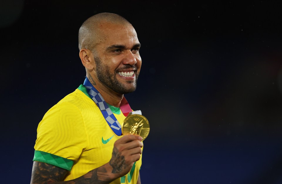 The full-back turned midfielder showed off his gold medal to the cameras