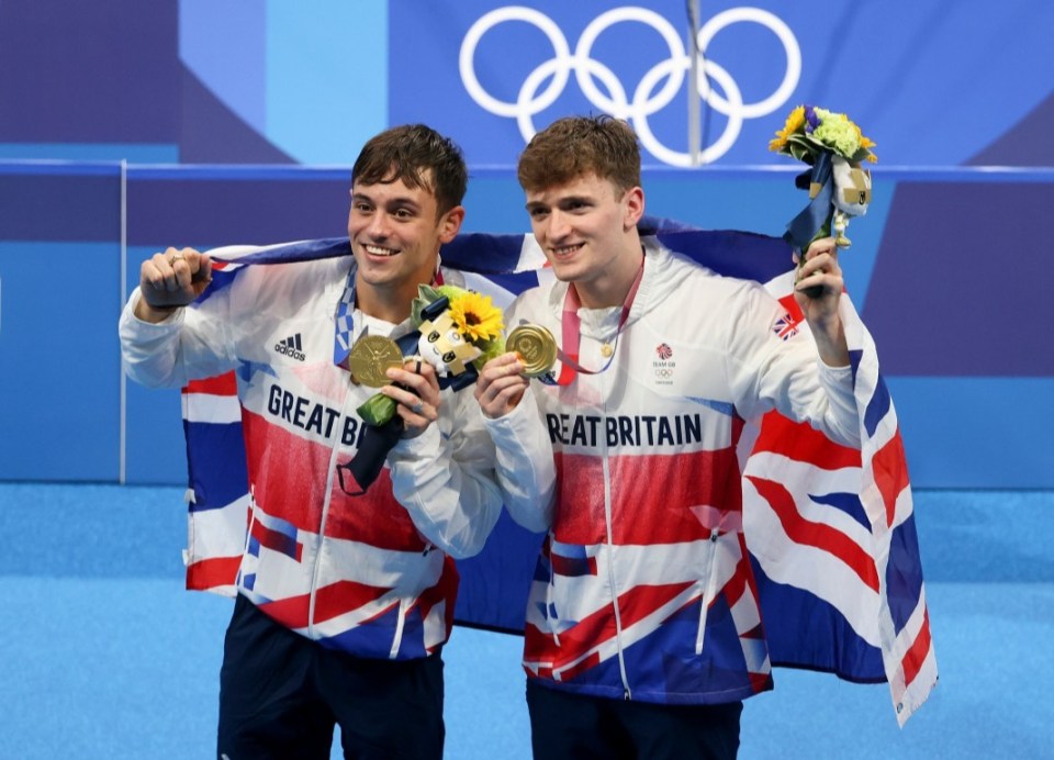 Daley poses withhis first Olympic gold medal alongside Matty Lee