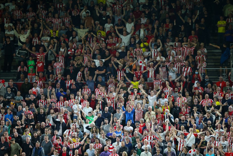 Brentford fans celebrate beating Arsenal