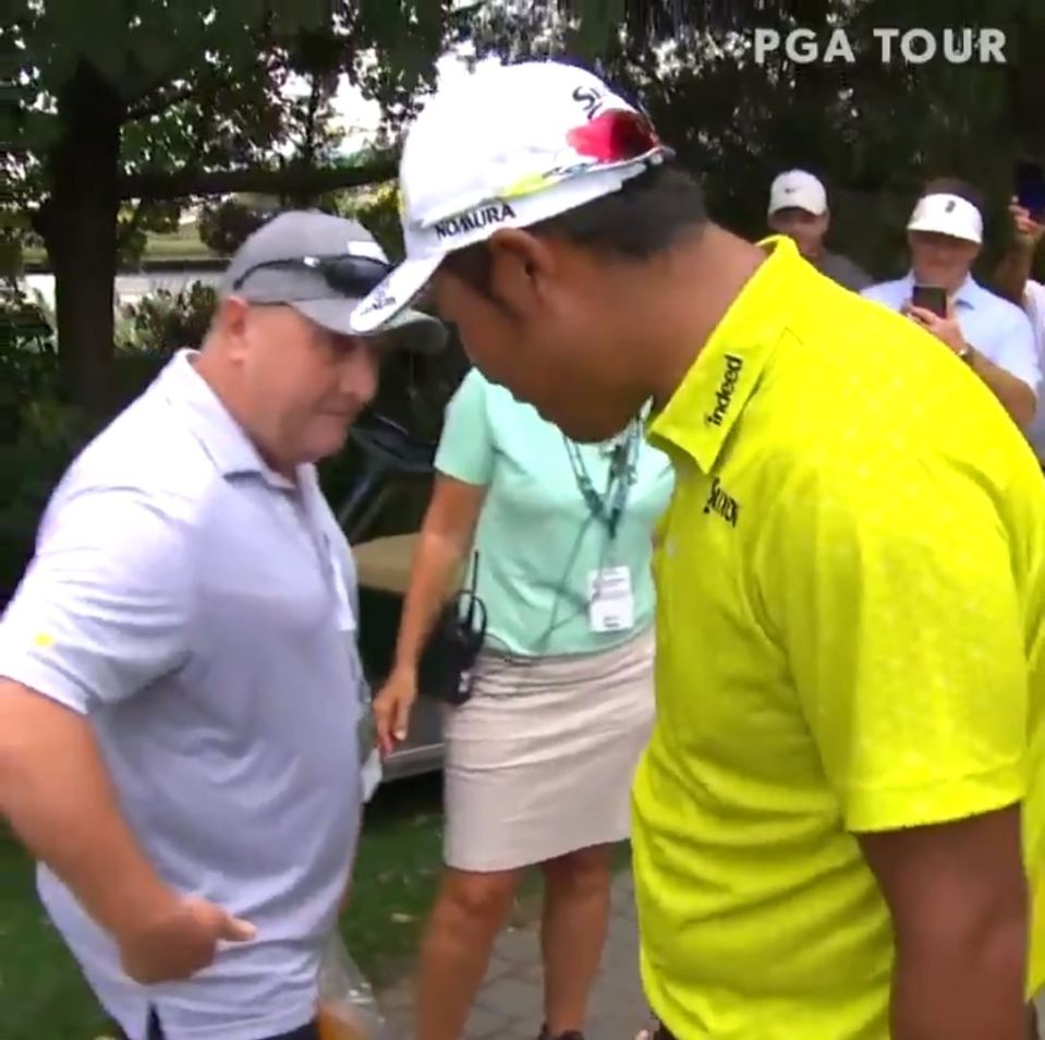 Hideki Matsuyama's drive somehow ended up inside a fan's shirt