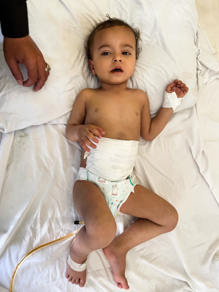 Little Muhammad was given a 30 per cent chance of survival after shrapnel pierced his body and now has an 80 per cent chance of survival after being taken to hospital in Pakistan