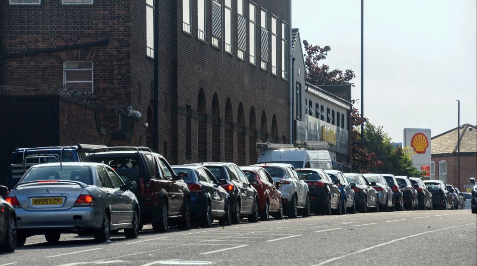 A long queue of vehicles wait to fill up at an Esso fuel station in Byker, Newcastle