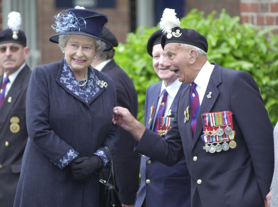 Veteran John Bellis gives Her Majesty a cheeky tug in 2012