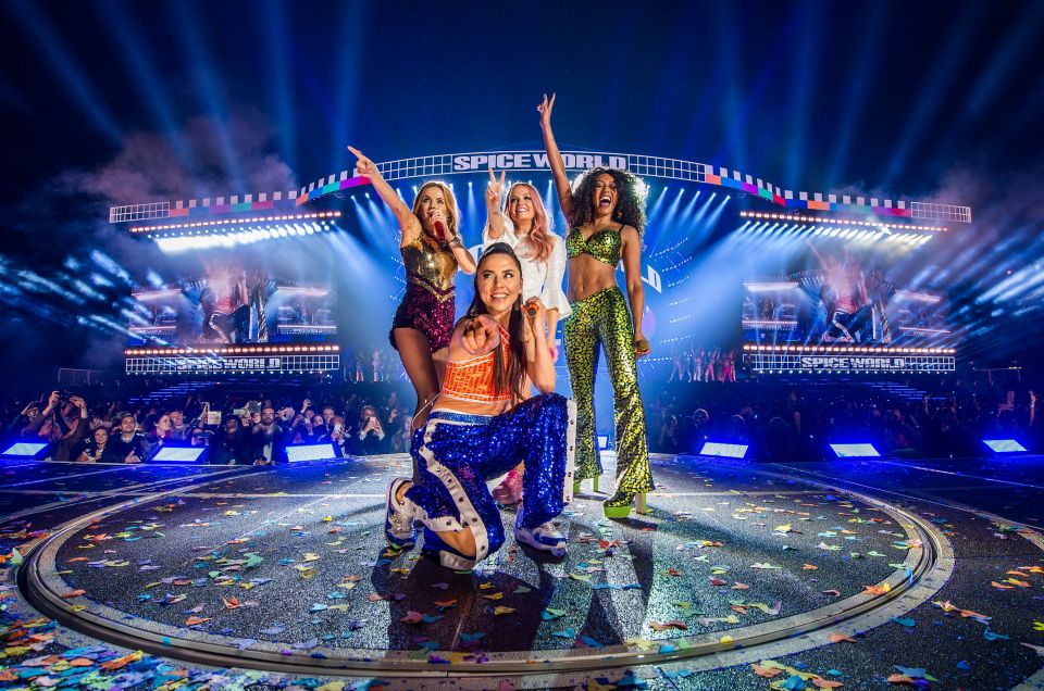 Geri alongside Mel B, Mel C, and Emma Bunton on the Spice World Reunion tour