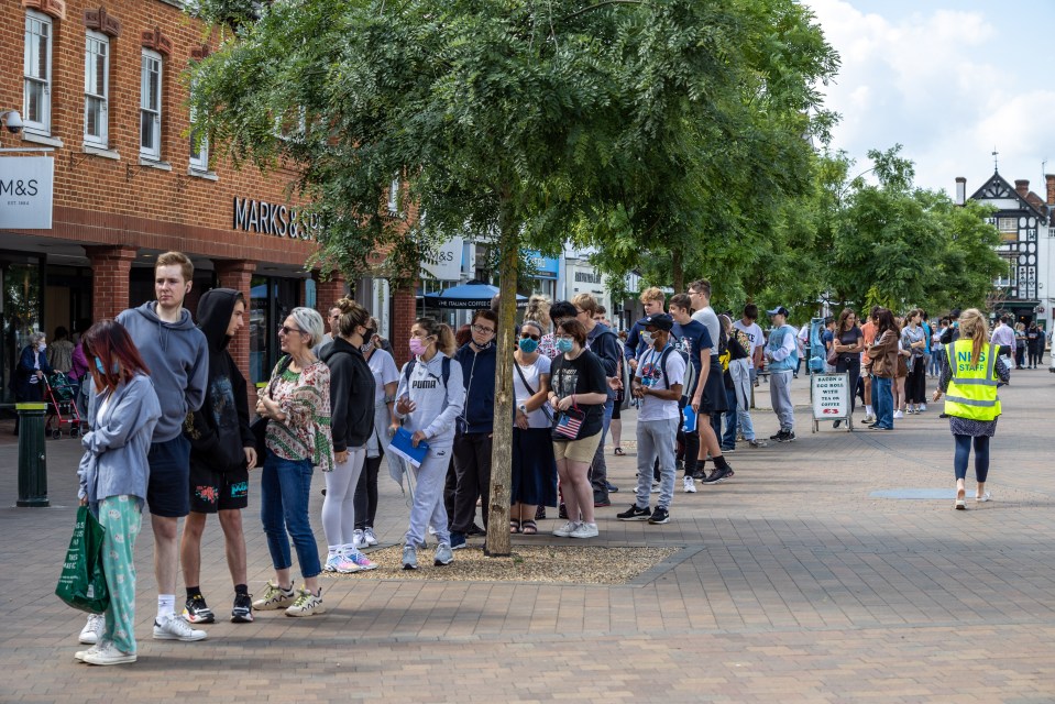 Young people will likely miss out on a third dose. Pictured: Queues for a vaccine centre in Epsom in August