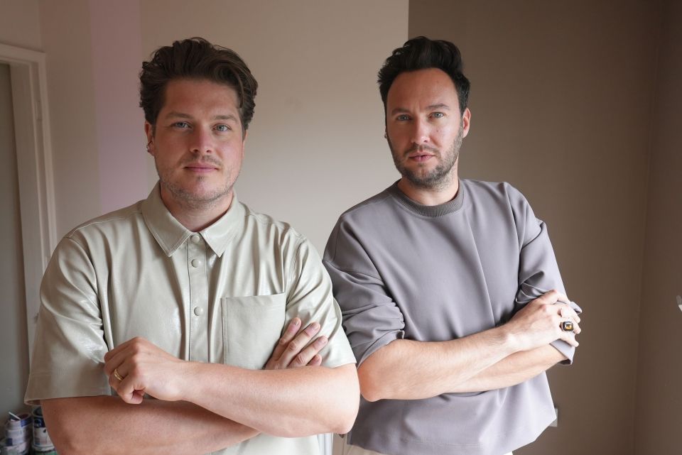 Jordan (right) has an interior design company with his husband Russell (left)