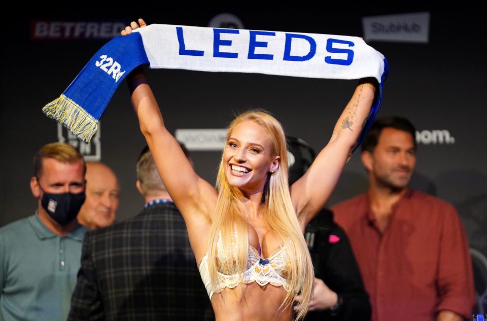 The Aussie held up a Leeds scarf at the weigh-in