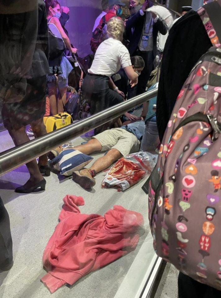 One man was pictured collapsed on the floor