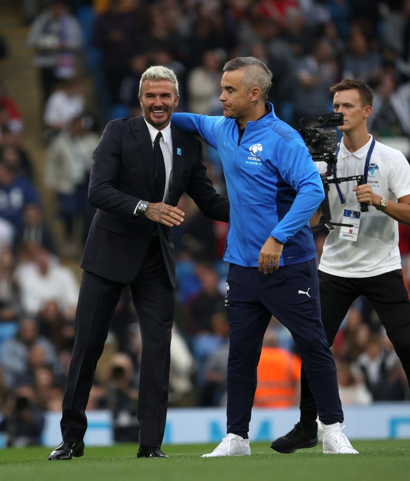 David Beckham and Robbie Williams shared a hug