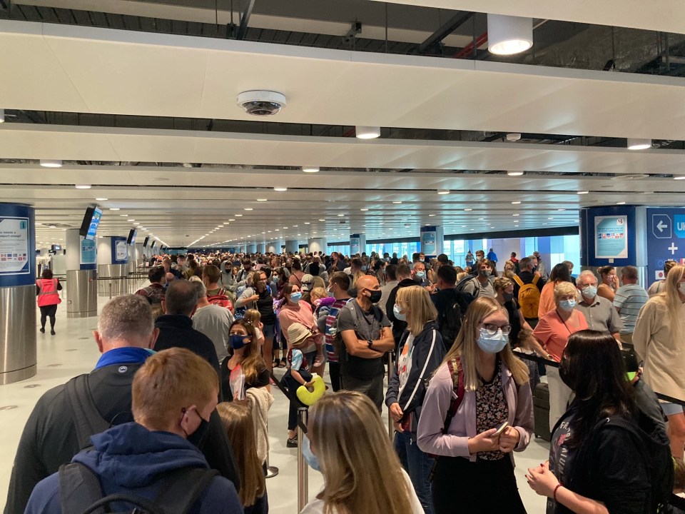 Queues of holidaymakers at Manchester today