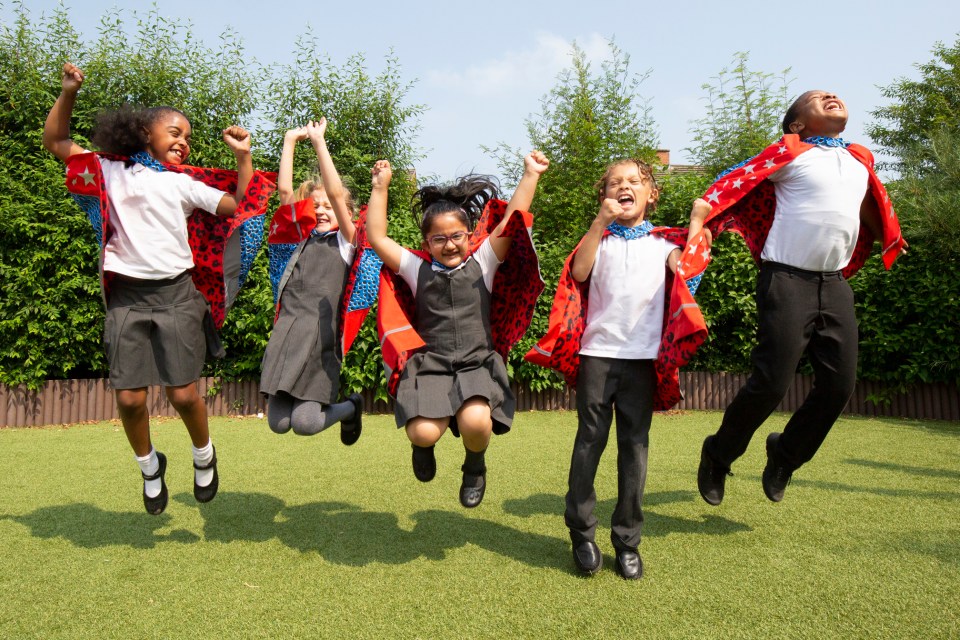 The capes help 'destroy' dirty air as the kids walk to and from school