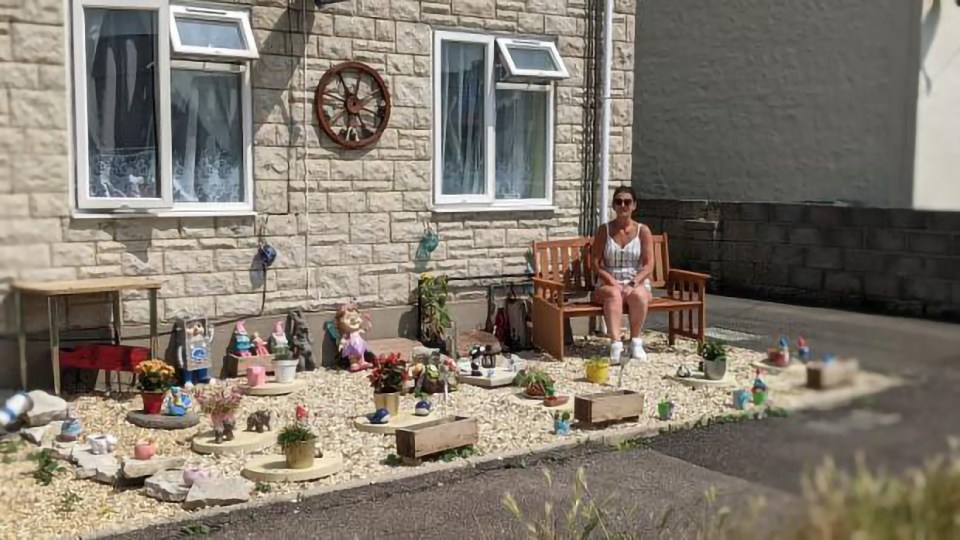 Emma Collins with her memorial garden for her late son