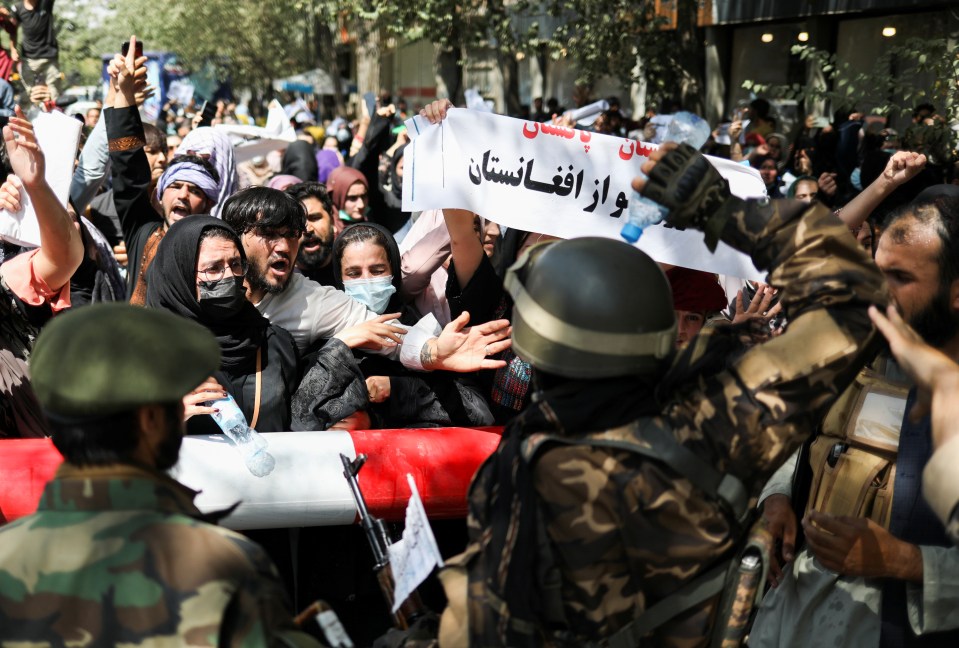 Taliban fighters block anti-Pakistan protesters in Kabul on September 7