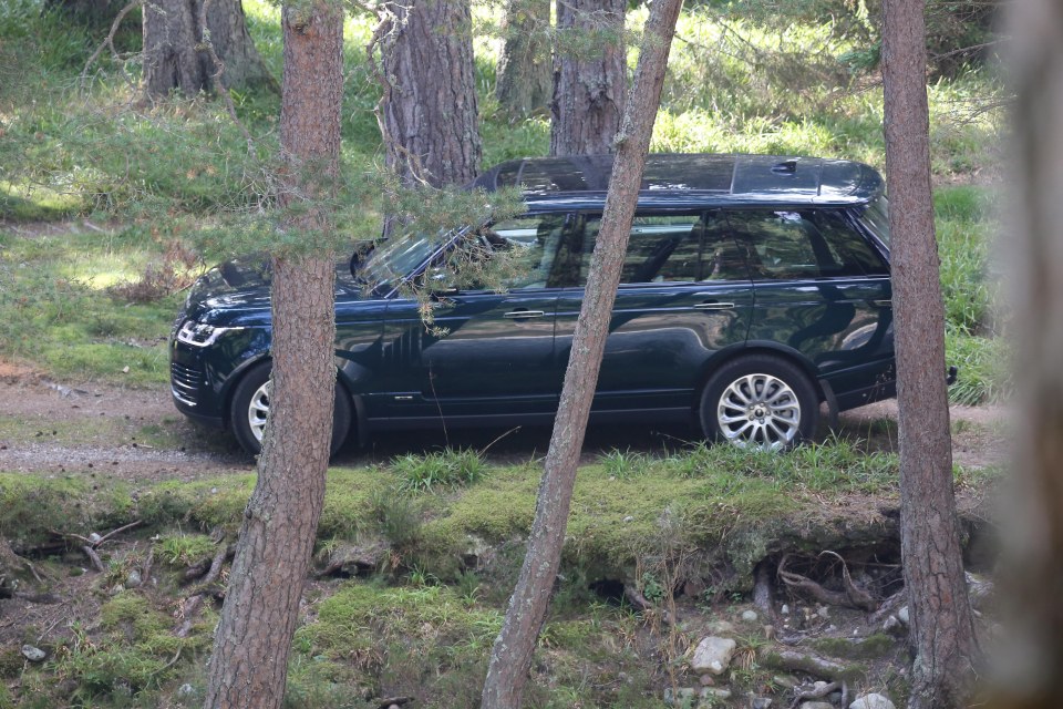 A member of staff drives Andrew's car away from the lodge