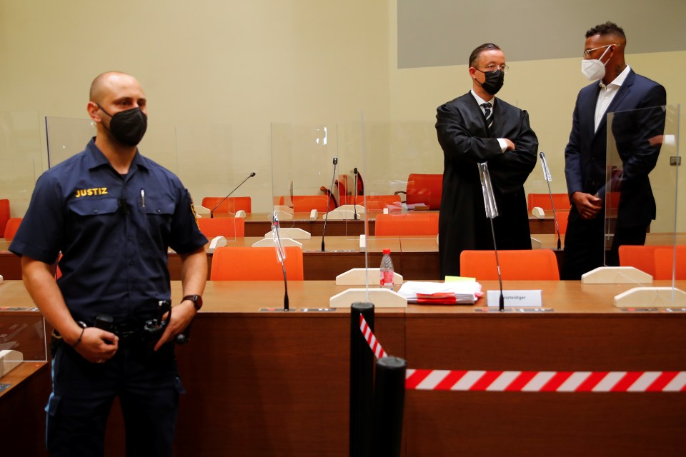 Boateng speaks with his lawyer Kai Walden at his trial at a regional court