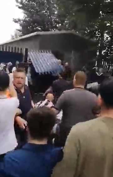 Footy yobs ripped down a ‘stadium fence’ during the mass punch-up