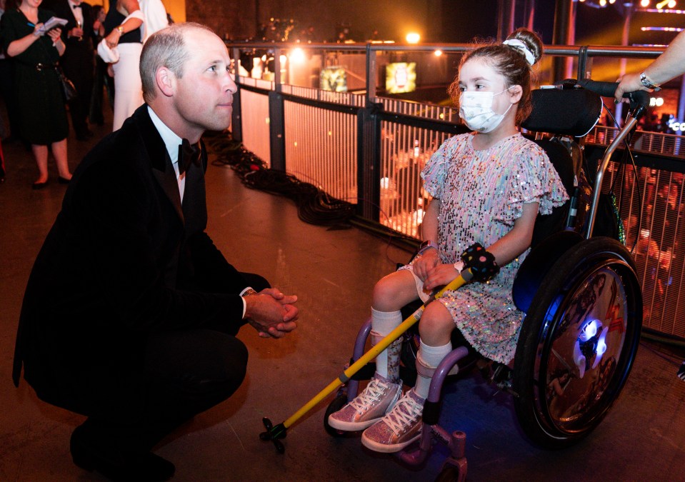 Prince William pointed to the lights on Carmela’s wheelchair and added: ‘I love your sparkly wheels’