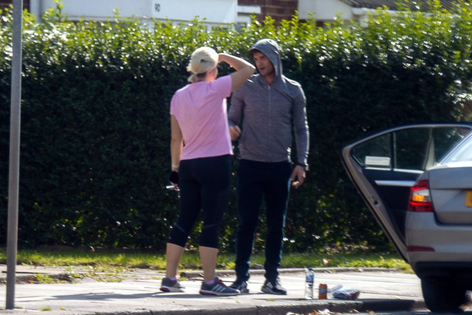 The dancing couple chatted close together before sharing a hug