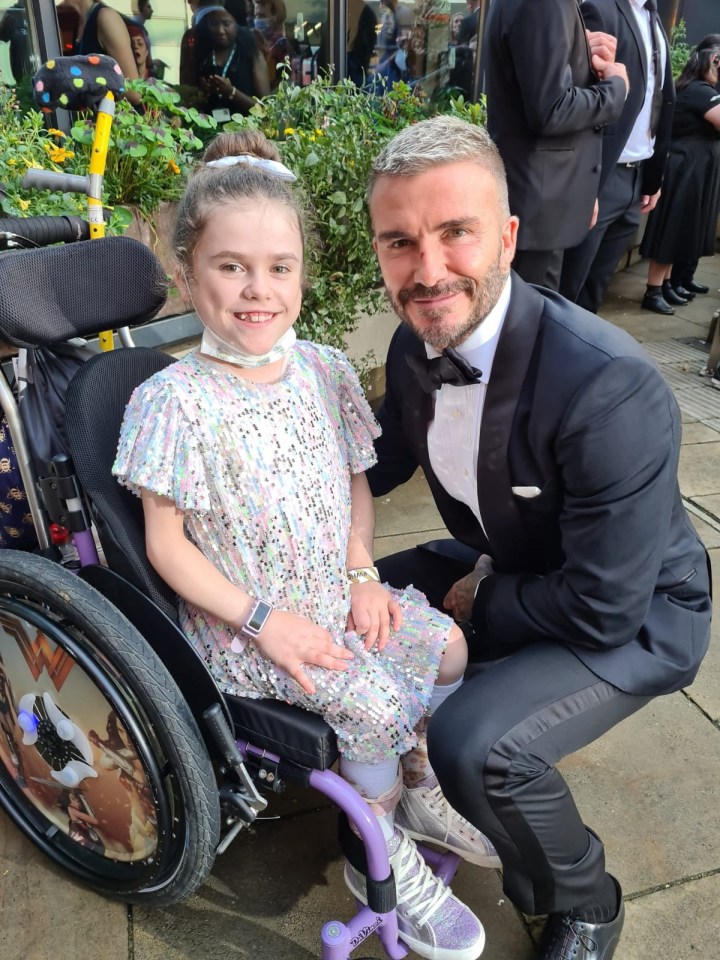 Carmela poses with new best pal David Beckham