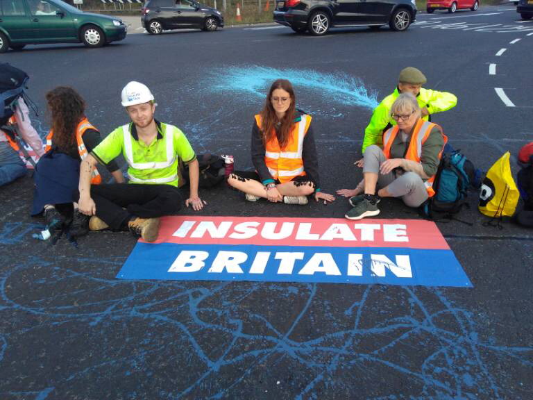 Smith, 28, who claimed to be a brickie, was pictured among activists gluing their hands to tarmac in rush-hour traffic on Monday