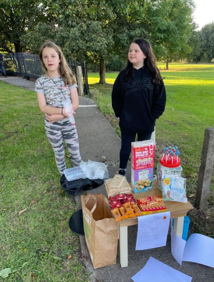 Late best friends Lacey Bennett and Connie Gent, both 11, were pictured behind a stall on Saturday raising money for cancer research just hours they were murdered