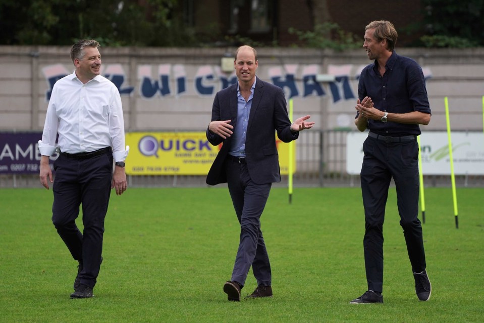 Prince William, pictured with Peter Crouch, declared his backing for grassroots football fans hoping to save the 'heart and soul' of their clubs