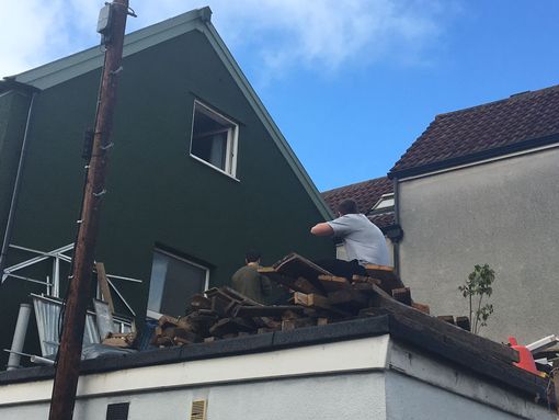 Residents protest on the property's roof