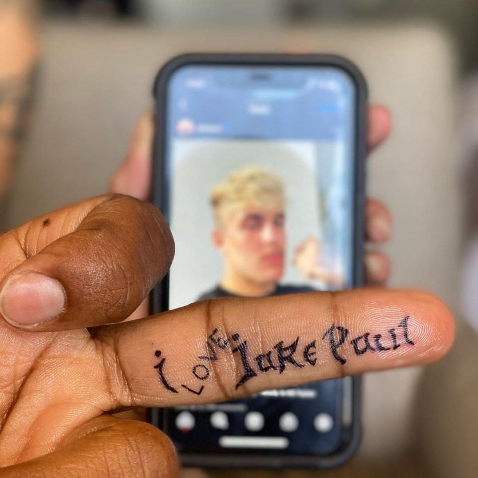 Tyron Woodley has had Jake Paul's name tattooed on his middle finger in his bid to secure a rematch