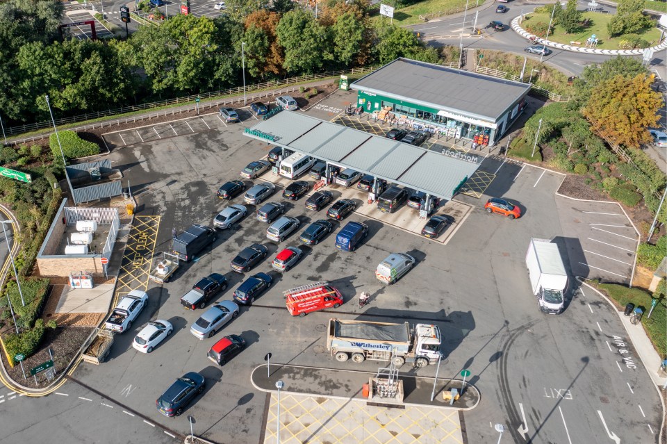 Long lines built up outside a service station in St Ives, Cambridgeshire today