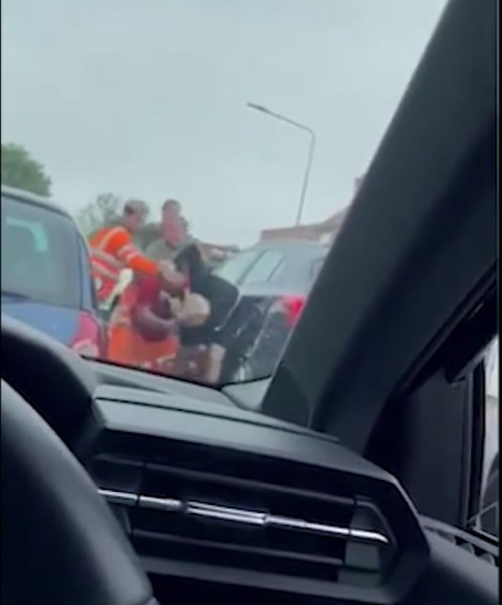 Drivers filmed the fight and beeped their horns