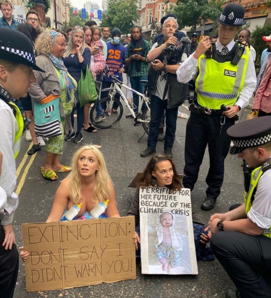 Laura alongside another protester, who was being spoken to by a police officer