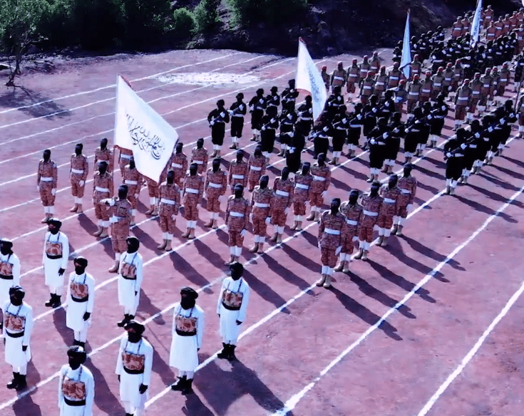 Taliban fighters could be seen waving flags and goose stepping in the North Korean-style parade